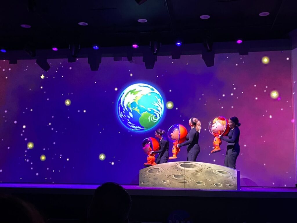 performers with peanuts characters puppets during Kennedy Space Center All Systems Are Go Show