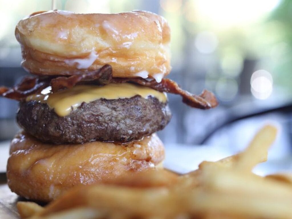 Teak pairs breakfast donuts with dinner burgers