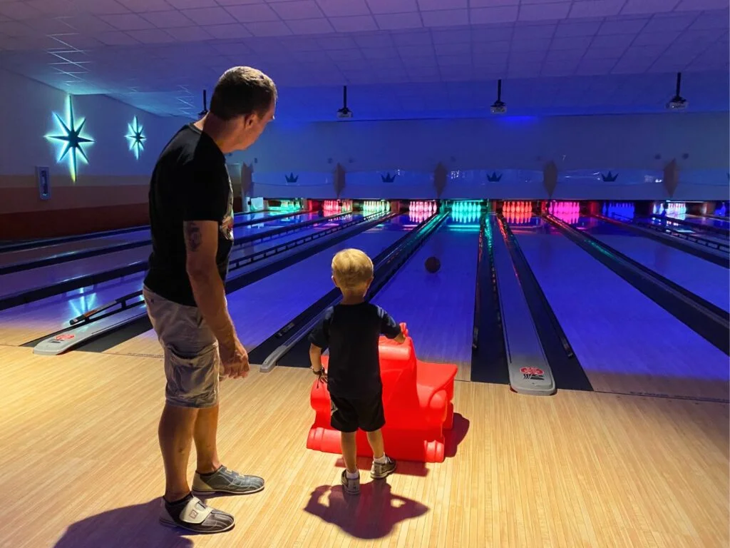 father and son at Bowling Alley at Universal's Cabana Bay Beach Resort
