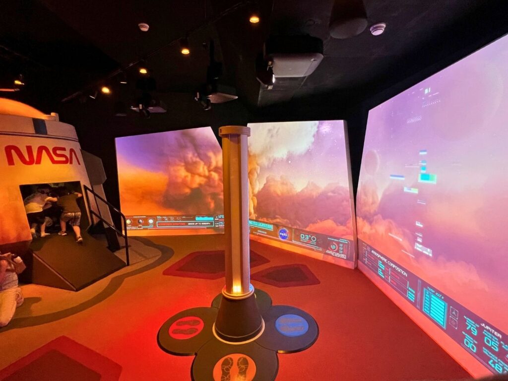 Interactive Game at Planet Play Kennedy Space Center involves powering a rocket launch with your feet
