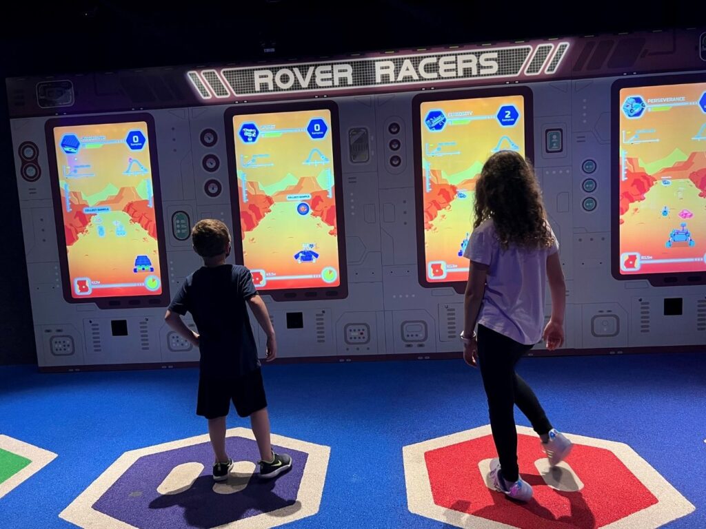 kids play on Rover Race Game at Planet Play Kennedy Space Center