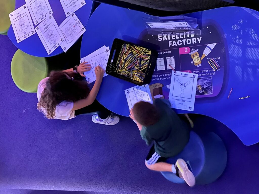 kids draw at Satellite Drawing Game at Planet Play Kennedy Space Center 