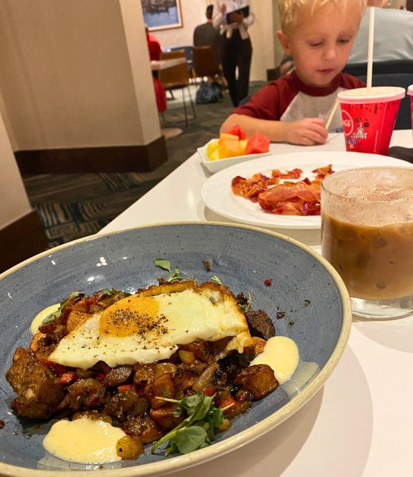Steakhouse 71 Breakfast hash and eggs, specialty coffee drink, bacon and fruit for kids