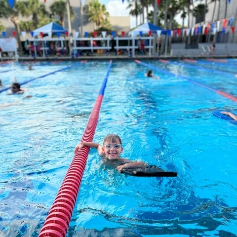 a boy swims in swimming lane 