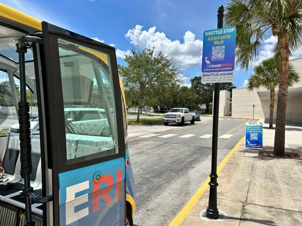 a shuttle sits at the Beep Autonomous Shuttle Altamonte Mall Stop 