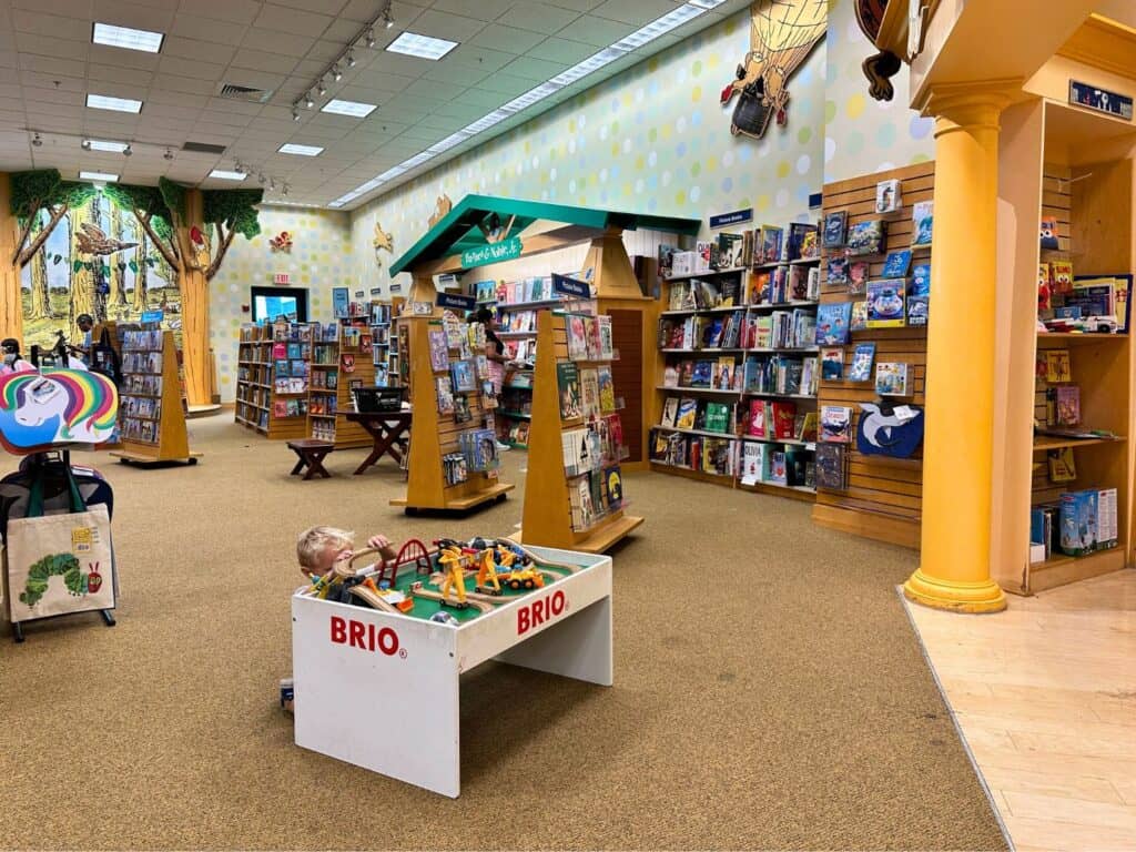a young boy plays with a toy set inside the Children's Section Barnes and Noble Altamonte Mall 