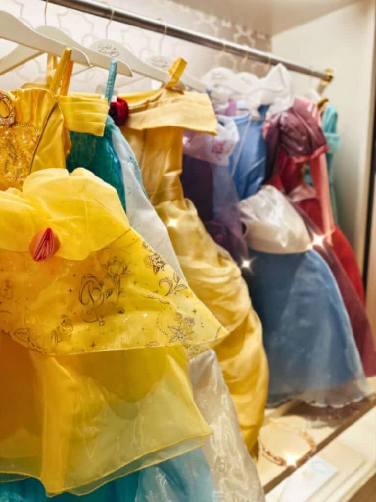 Disney Princess Dresses hang on display for Magical Makeover - image by Four Seasons Orlando Resort
