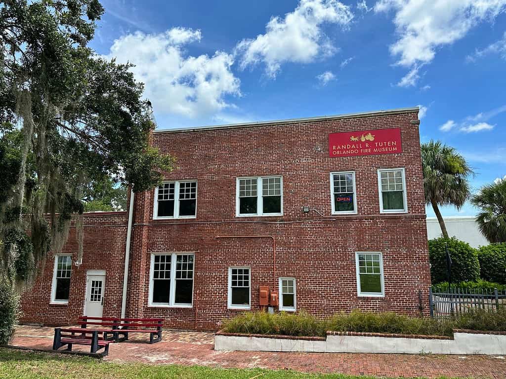 Exterior of Orlando Fire Museum brick building with blue skies above