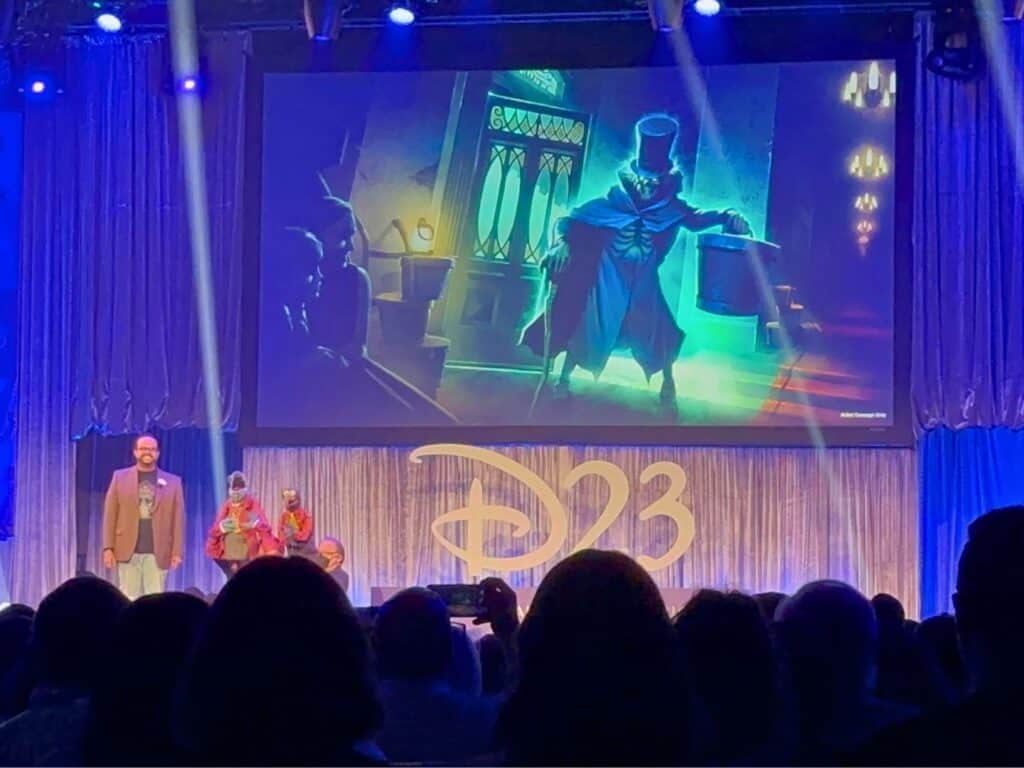 Daniel Joseph, a principal special effects designer and illusion development lead at Walt Disney Imagineering on stage with Muppets characters sharing more info about the Hatbox Ghost at Walt Disney World Haunted Mansion
