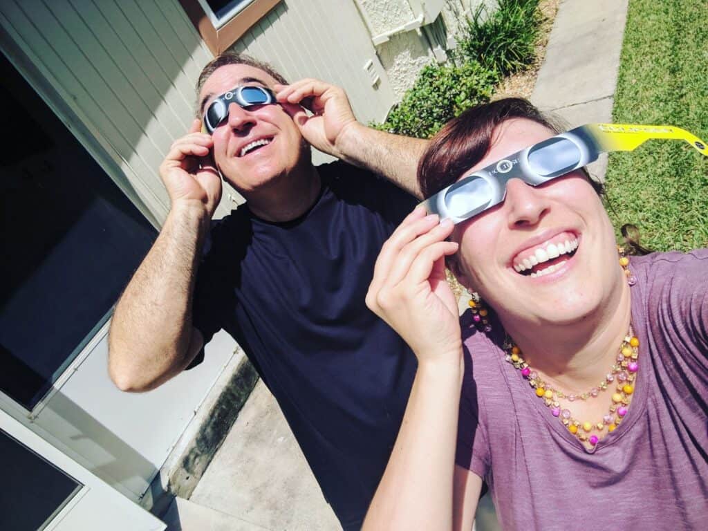 husband and wife don their Solar Eclipses Viewing Glasses in Orlando 