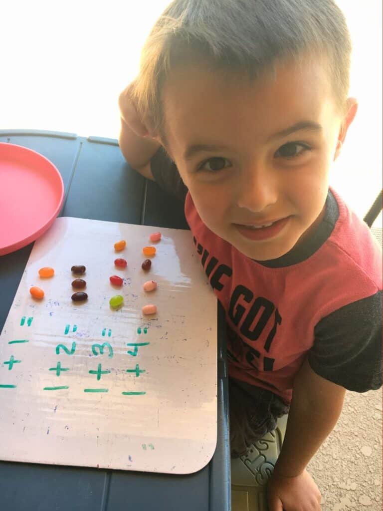 Young Boy Conducts Math Activity with Halloween Candy in Orlando - image by Nancy DeVault