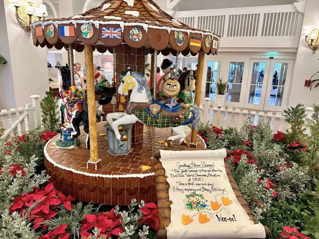 Disneys Beach Club Resort Gingerbread Carousel With Duck Tales Characters and Sign Describing the Carousel theme