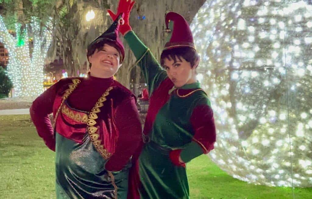 two elf characters pose for pictures at Lake Eola Park Orlando