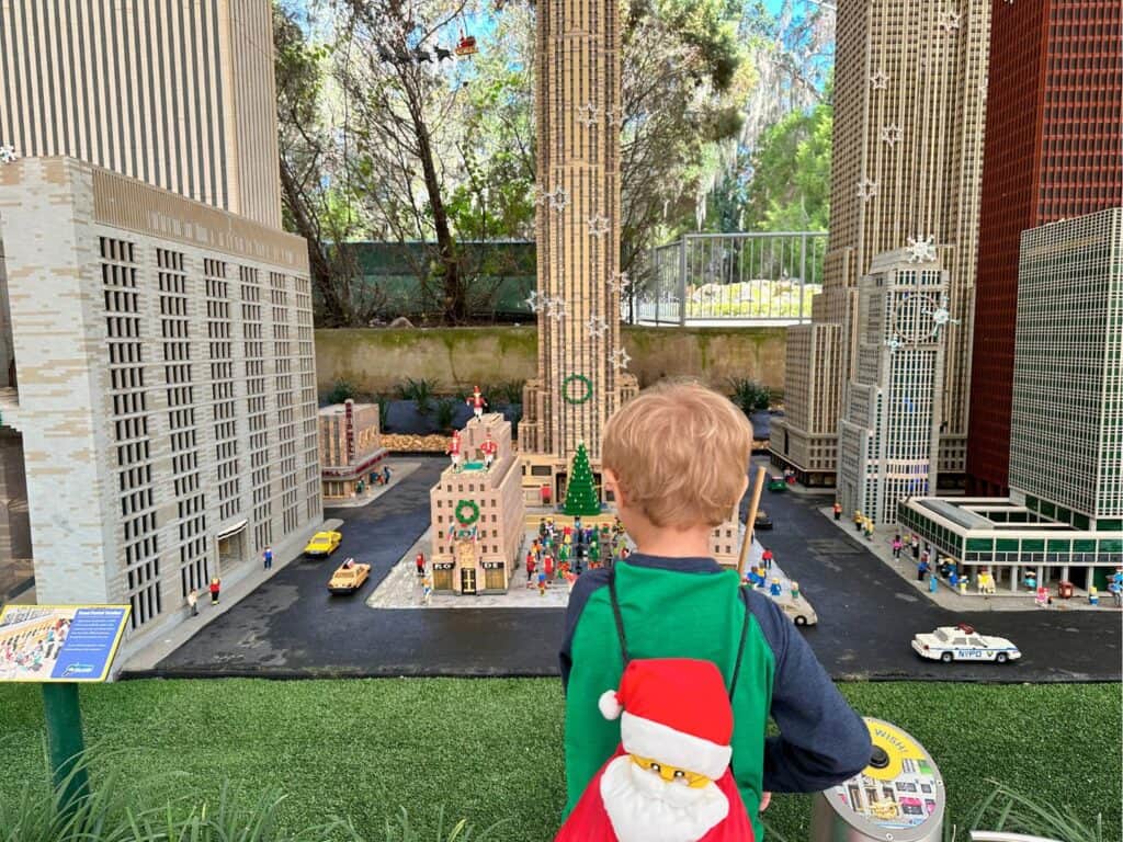 a young boy looks at Holiday Decorations in NYC Area of Miniland U.S.A. LEGOLAND Florida 