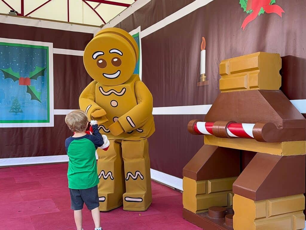 LEGO Gingerbread Man at LEGOLAND Florida greets young boy 
