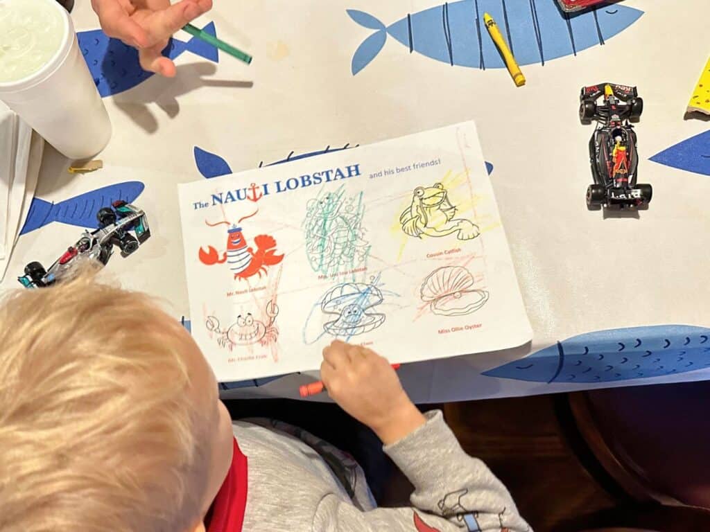 Child coloring at Nauti Lobstah Seafood Restaurant in Apopka