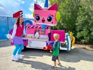 Young Boy Dances with Holiday Unikitty LEGOLAND Florida - image by Dani Meyering