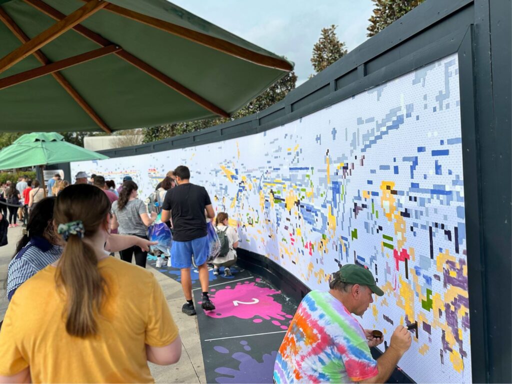 Guests Participating in Paint by Numbers Mural EPCOT Festival of the Arts 2024 - image by Dani Meyering