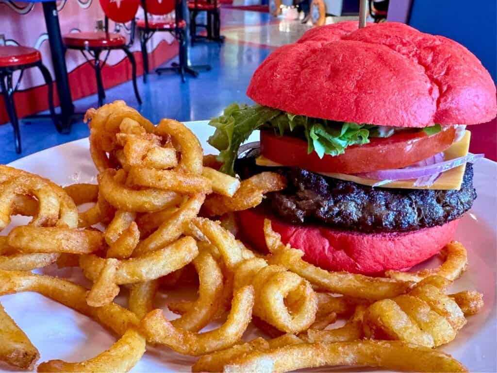 Image of The Big Top Burger with curly fries at Circus McGurkus Restaurant