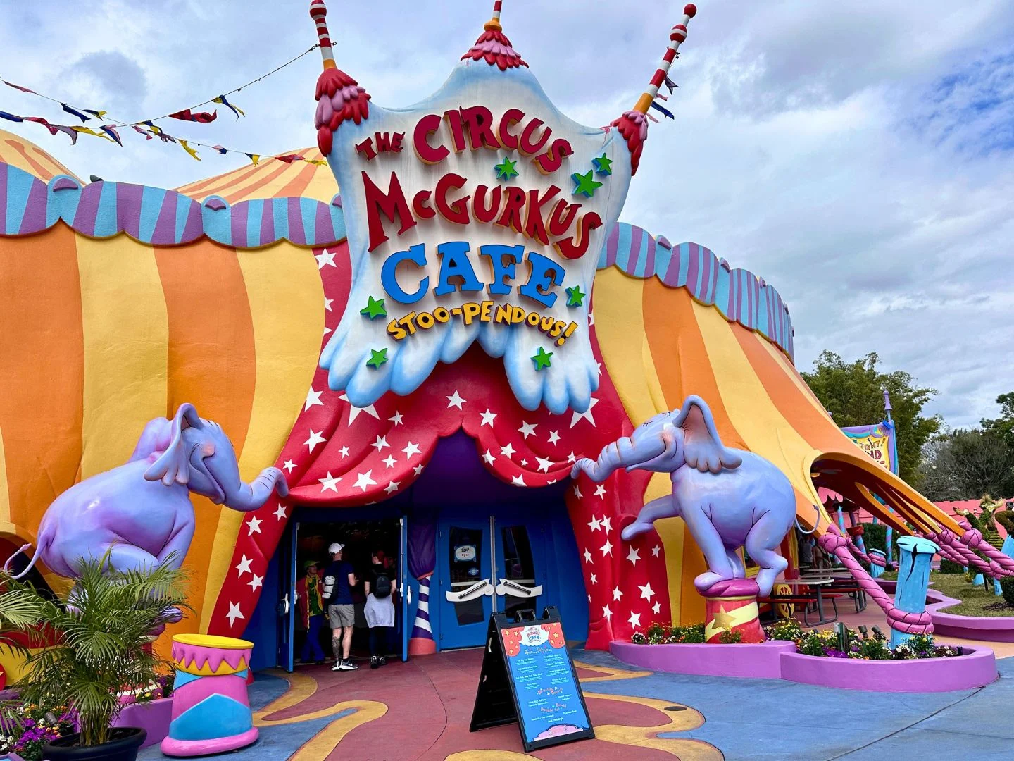 Image of Circus McGurkus Restaurant Entrance with two purple elephants on either side