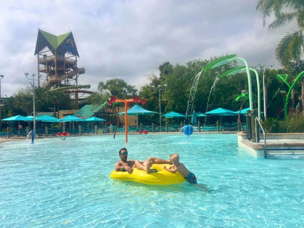 Father and Son Enjoy Turi's Kid Cove Swimming Area Aquatica Orlando 