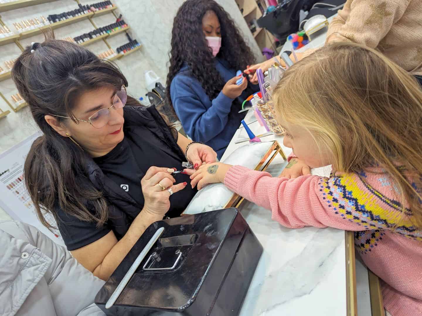Image of a little girl getting a manicure