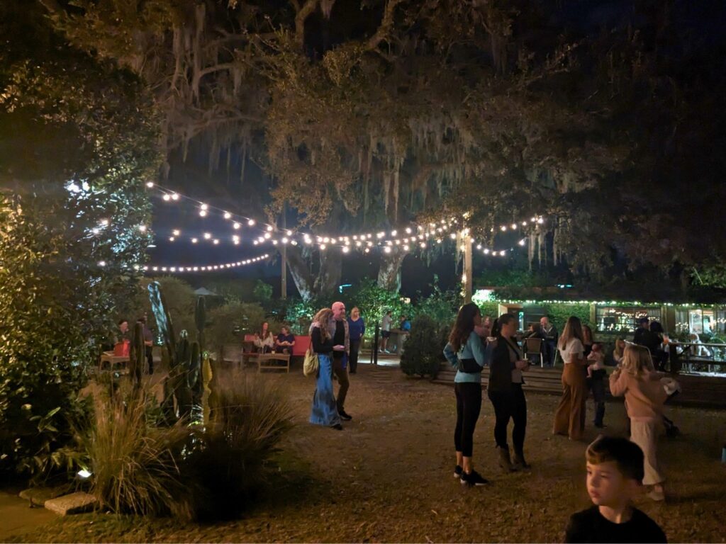 Image of people at The Acre Orlando at night