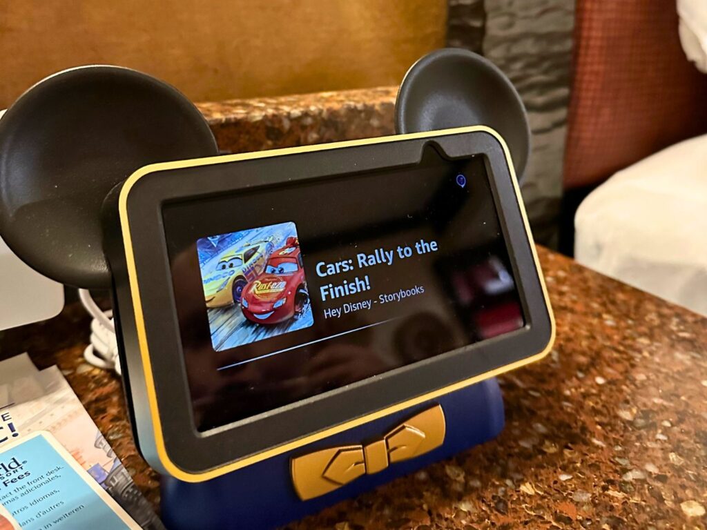 Hey Disney Voice Assistant Inside Disney's Animal Kingdom Lodge Resort hotel room displaying a Cars audio book