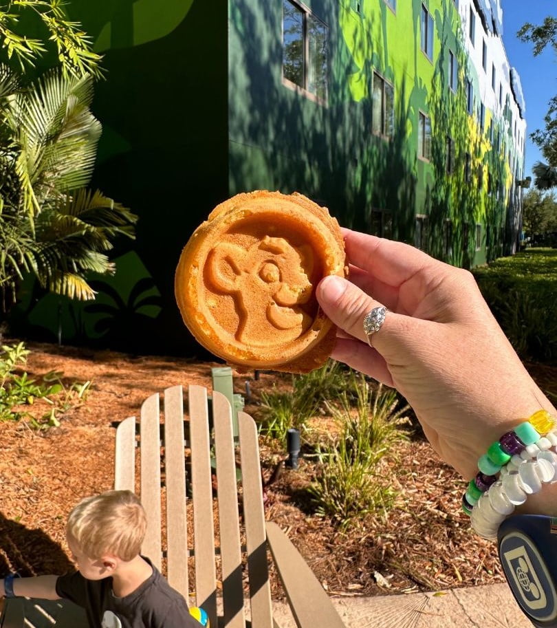 mom holding a Lion King Waffle for Breakfast at Disney's Art of Animation Resort 