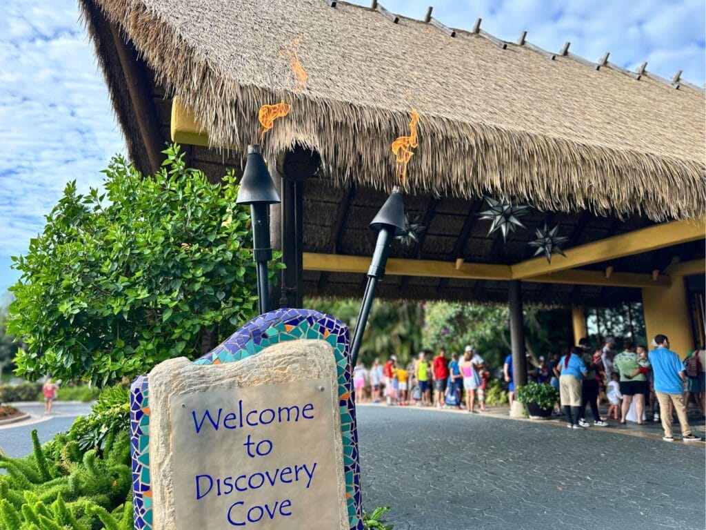 Discovery Cove welcome sign and check in line - image by Dani Meyering