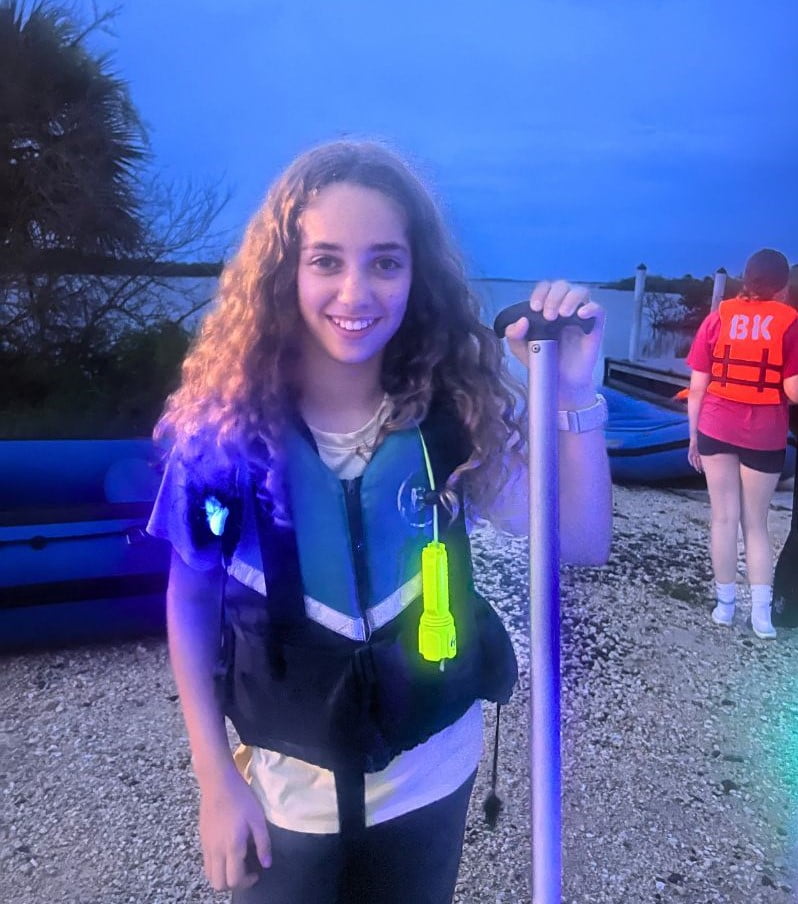 Teen Girl gets ready for Bioluminescence Tour Near Orlando with BK Adventures 