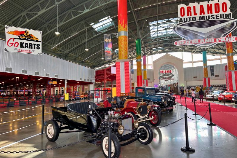 Inside Dezerland Orlando main entrance with cars on display and indoor go karts