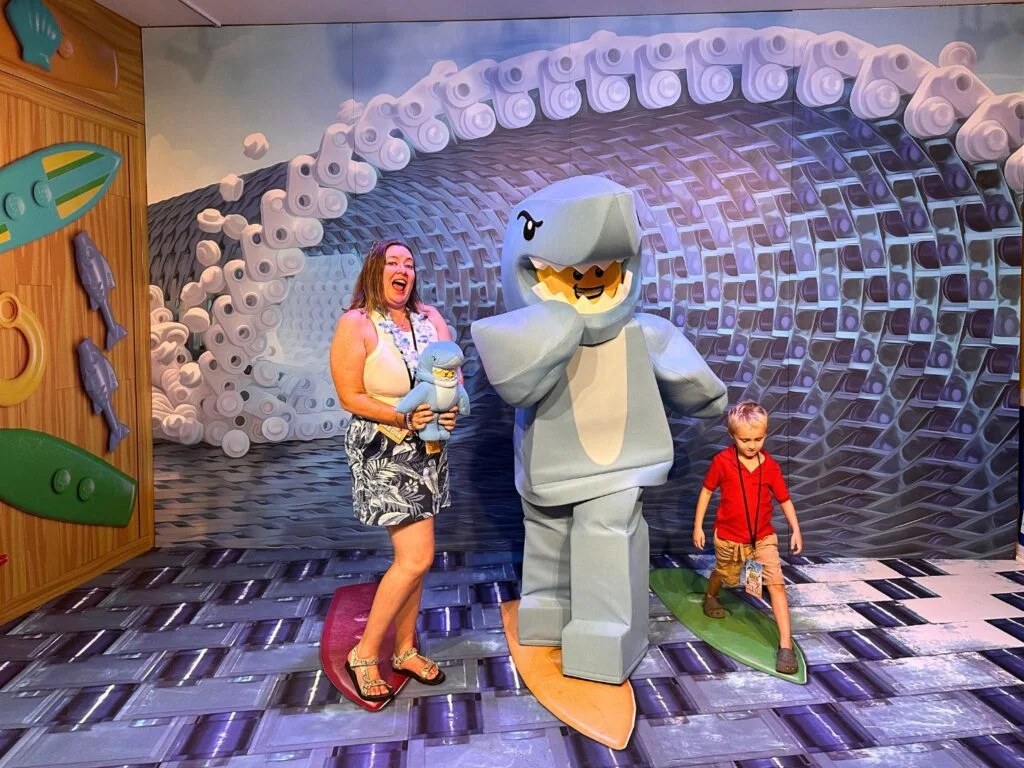 Mother and son pose with LEGO Shark Suit Guy new meet and greet location at Summer Brick Party LEGOLAND Florida