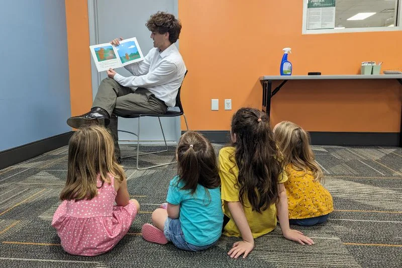 group of kids listen to story at orange county library