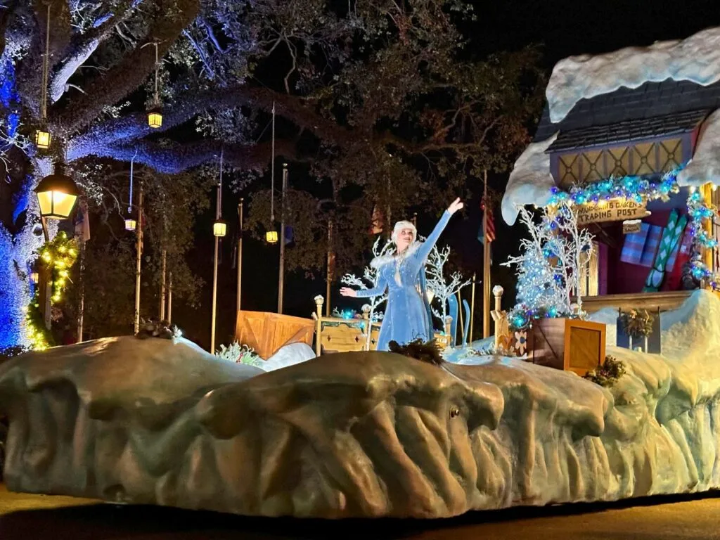 Elsa on Frozen themed float in Disney Christmas parade at Magic Kingdom