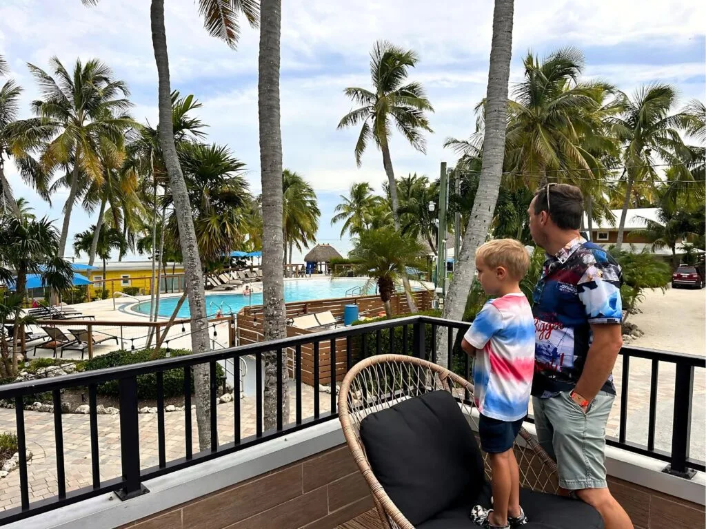Boy and Dad on balcony at La Siesta Resort & Villas
