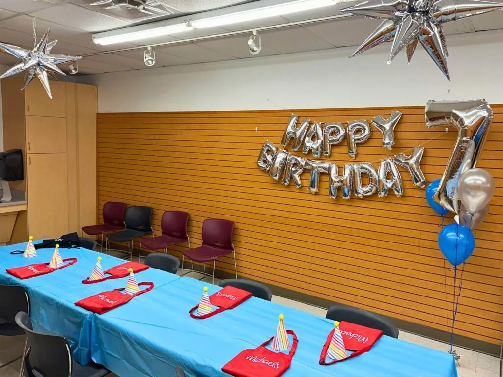 Party room with decorations and birthday balloons provided by Michaels Birthday Parties