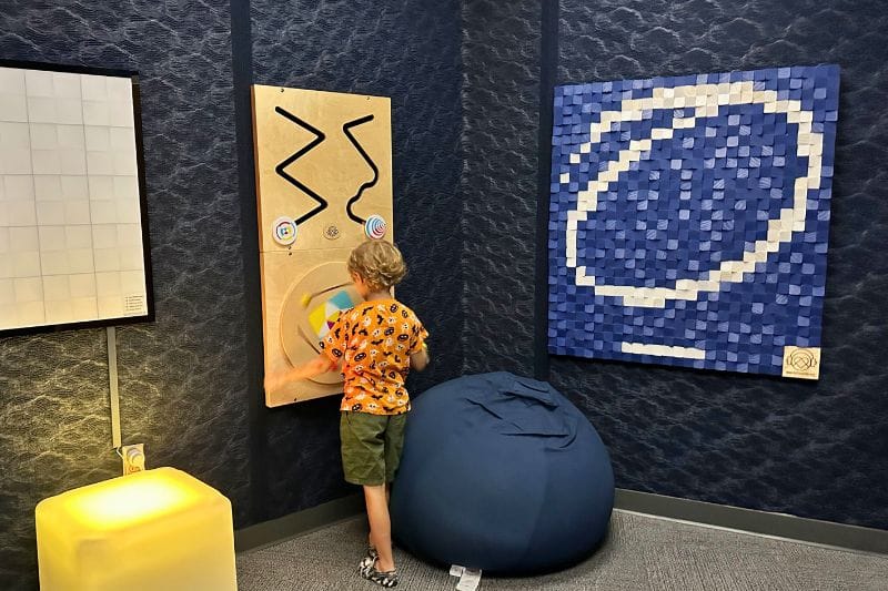 boy uses sensory room at Orlando Science Center - image by Dani Meyering feature