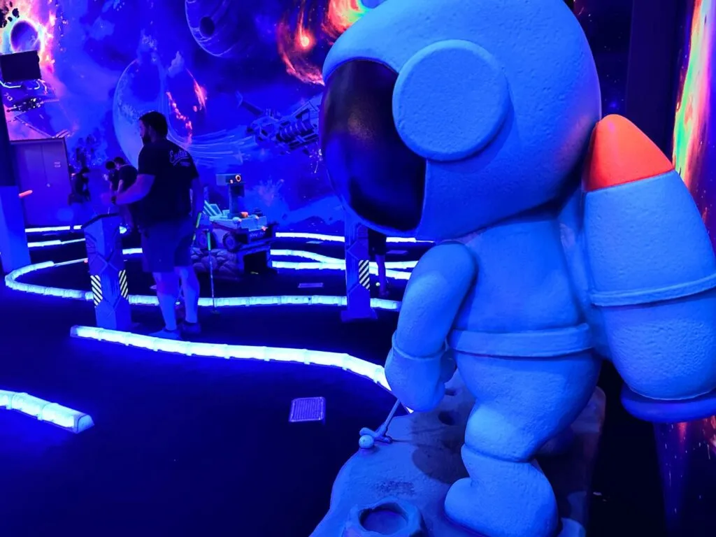 space themed Affordable Black Light Mini Golf at Elev8 Orlando Sanford - image by Dani Meyering