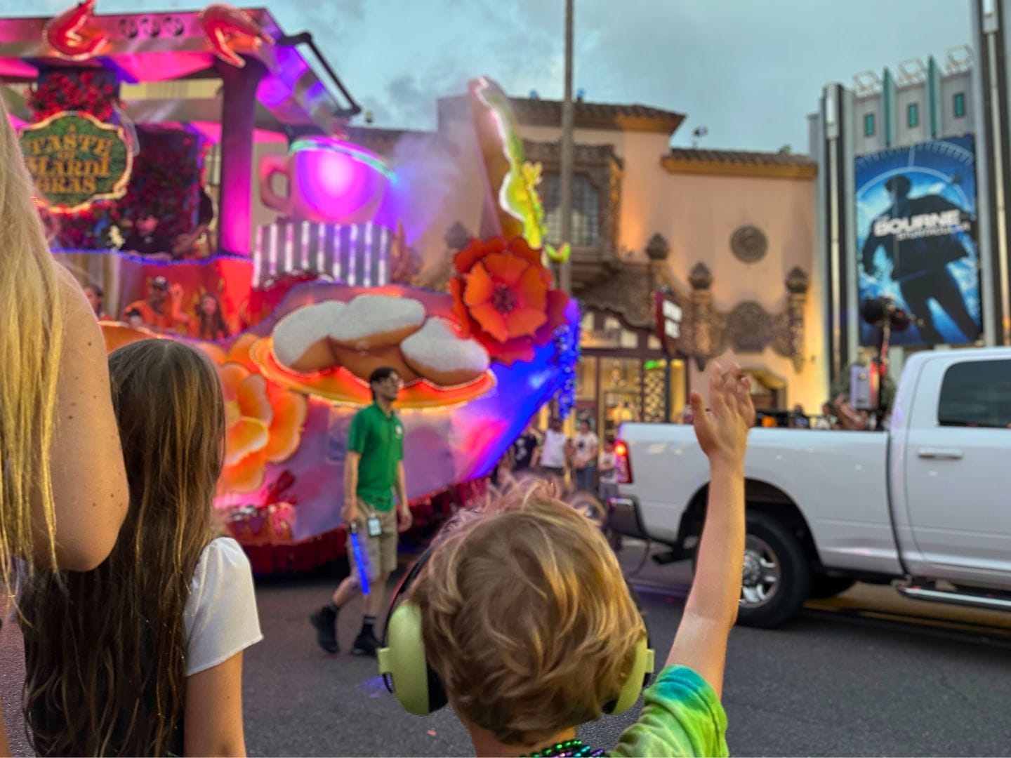 Young boy reaches out for beads at Children's Viewing Area Universal Mardi Gras Parade - image by Dani Meyering