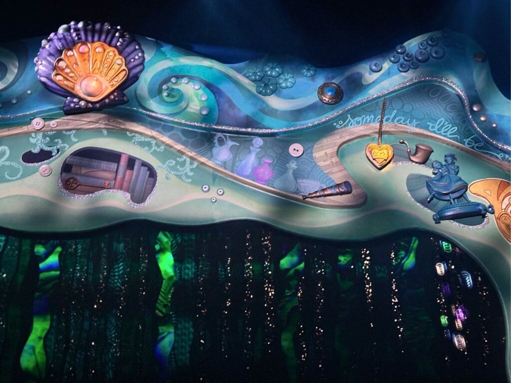 Proscenium arch with scrapbook style details at The Little Mermaid A Musical Adventure