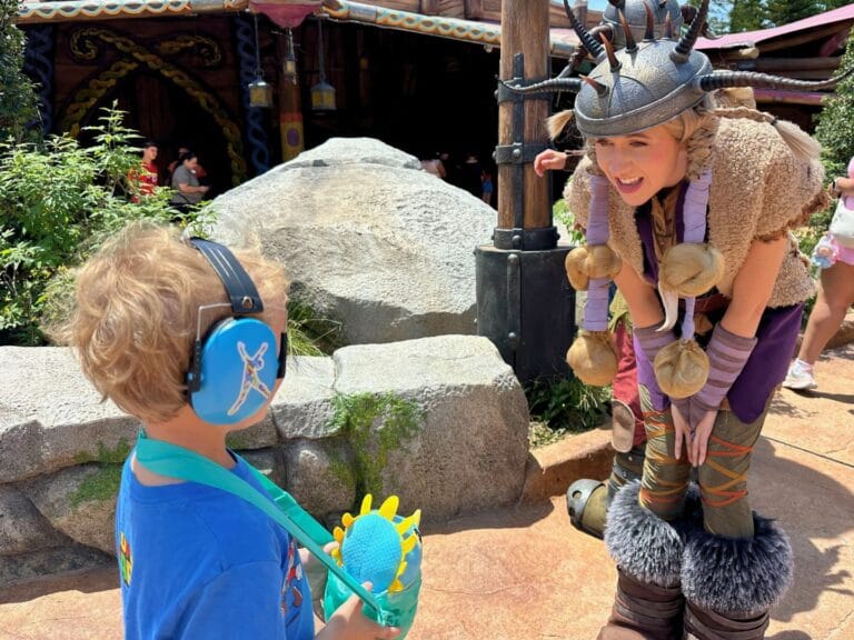 Ruffnut Character chats with young boy in How to Train Your Dragon Isle of Berk Epic Universe image by Dani Meyering.jpg