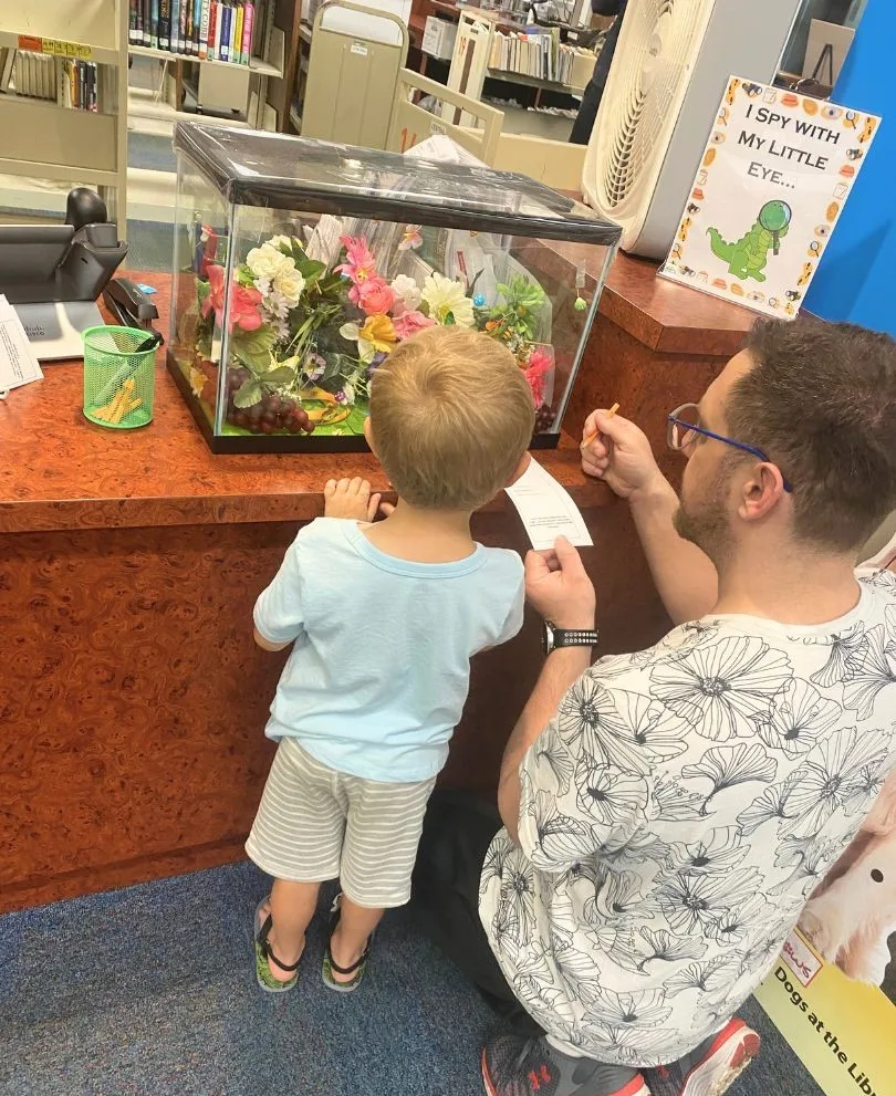 Young boy participates in Eye Spy activity at Seminole County Library - image by Dani Meyering