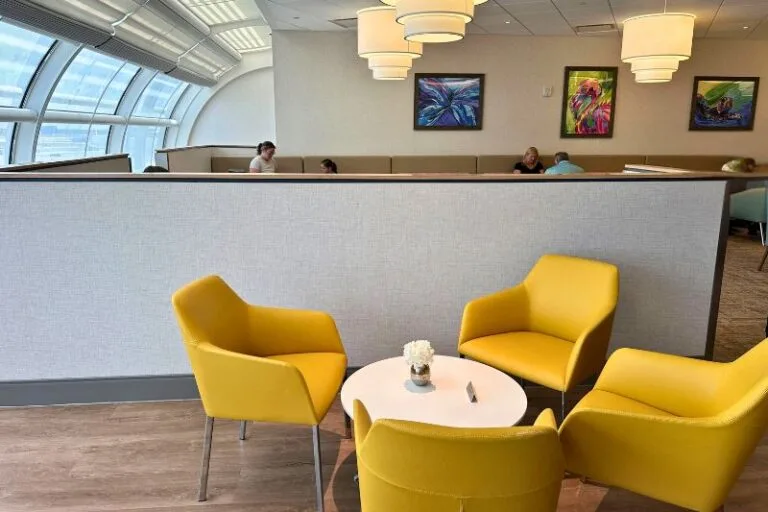 Club MCO Lounge orange and colorful lounge seating and window - image by Dani Meyering compress