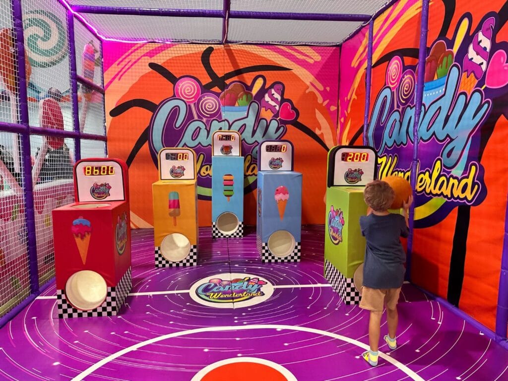 Candy Wonderland in Palm Bay young boy plays in basketball area - image by Dani Meyering
