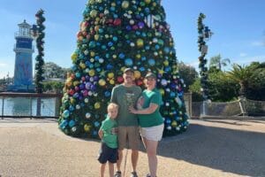 SeaWorld Orlando Christmas Celebration Family of 3 by Christmas Tree - image by Dani Meyering
