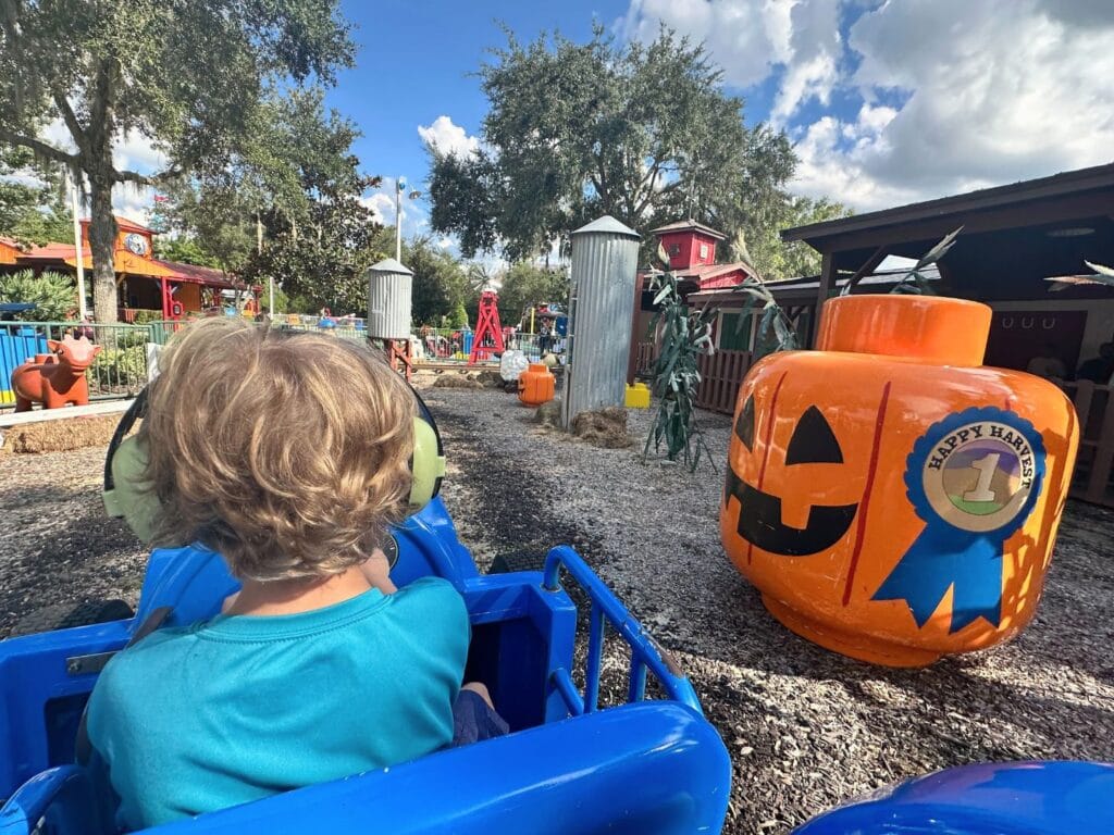 young boy on Duplo Valley Happy Harvest Tractor Ride at Legoland Florida - image by Dani Meyering