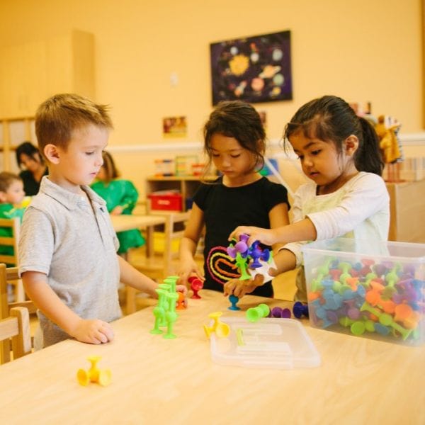Children playing at their desk