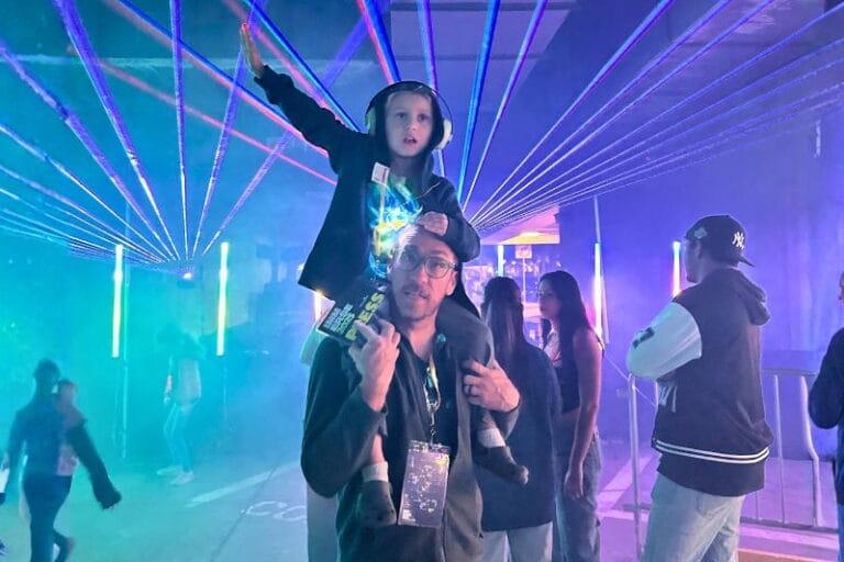 Father and son at IMMERSE Downtown Orlando light show events 2026 - image by Dani Meyering