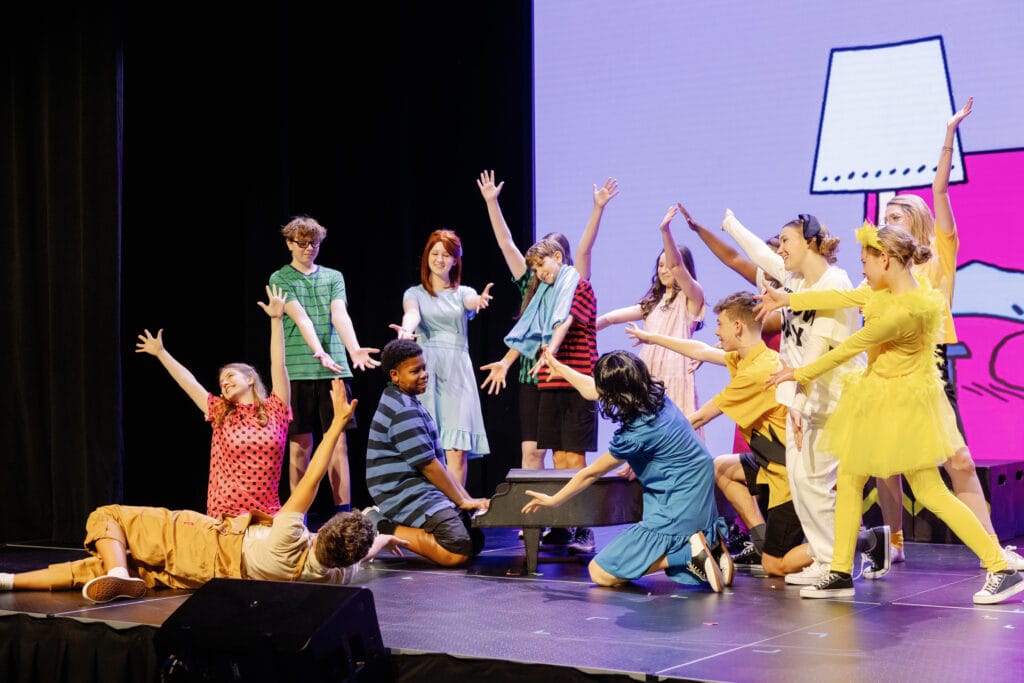 The First Academy Students performing at school play